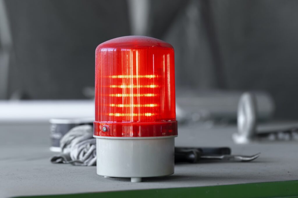 Warning light alarm in industrial plant close up